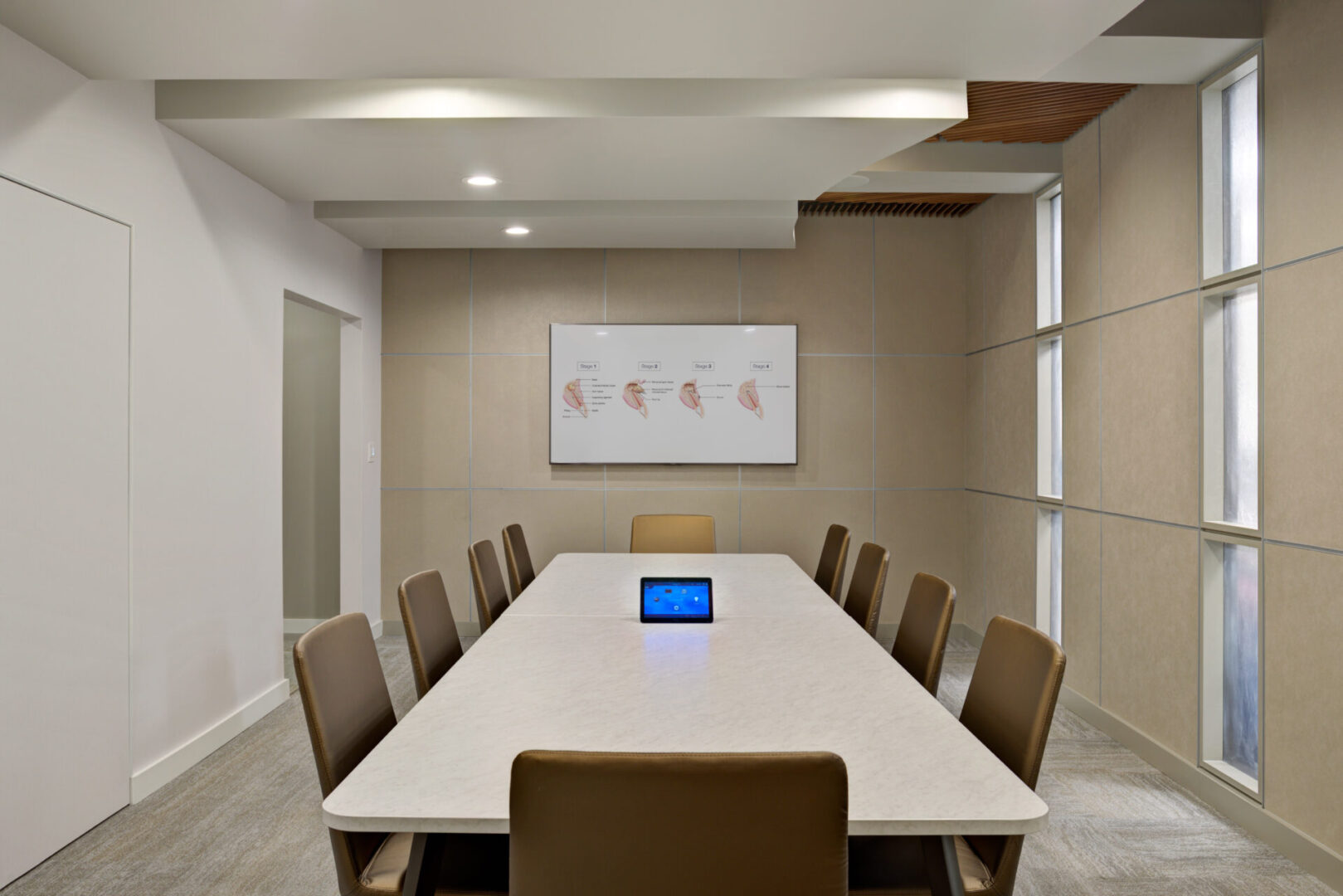A conference room with a table and chairs
