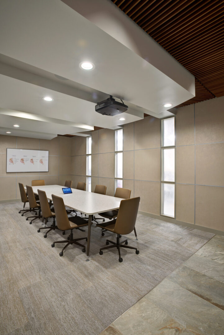 A conference room with chairs and tables in it