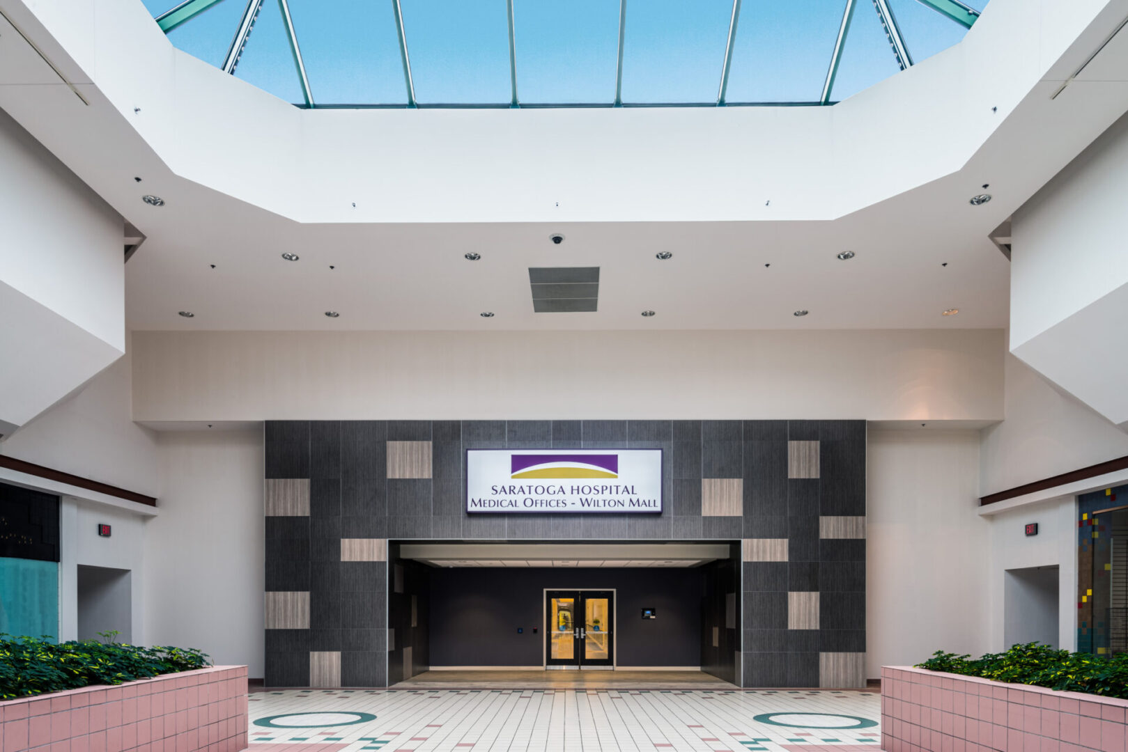 A large lobby with a skylight and a large entrance.